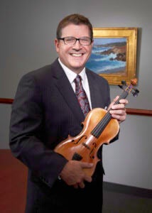 Steve holding a violin